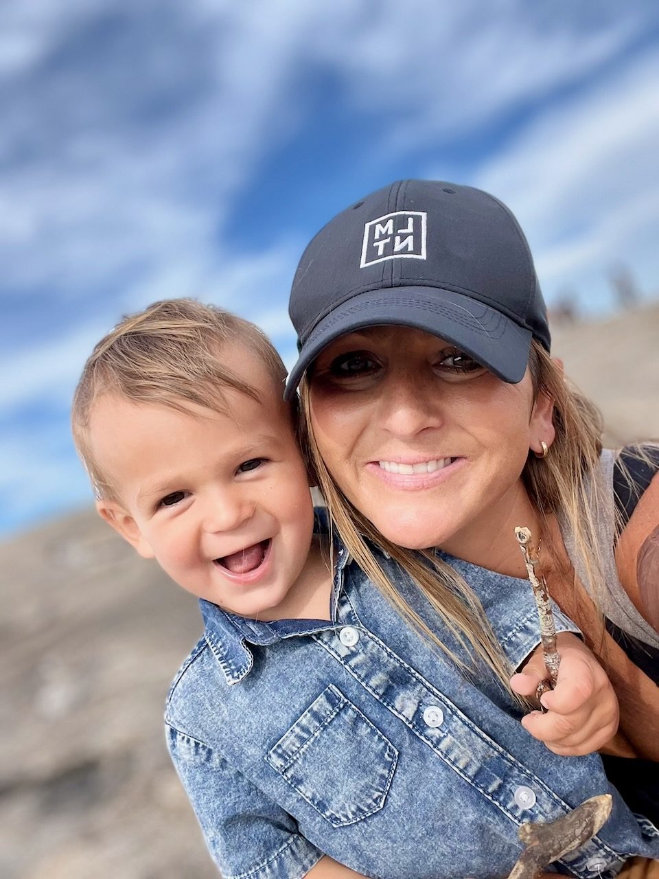 Danielle smiling with her young son