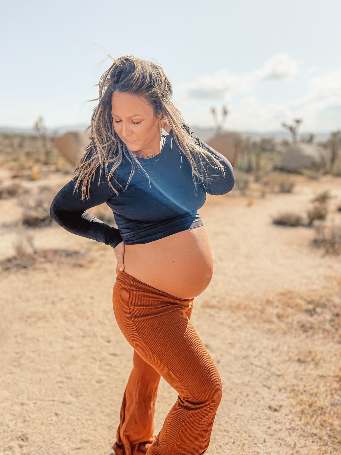 Expecting mother in warm desert light
