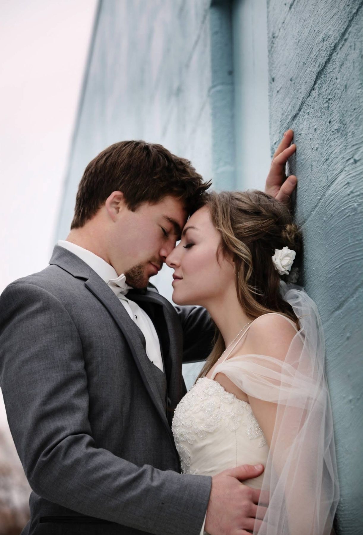 Bride and groom, foreheads touching